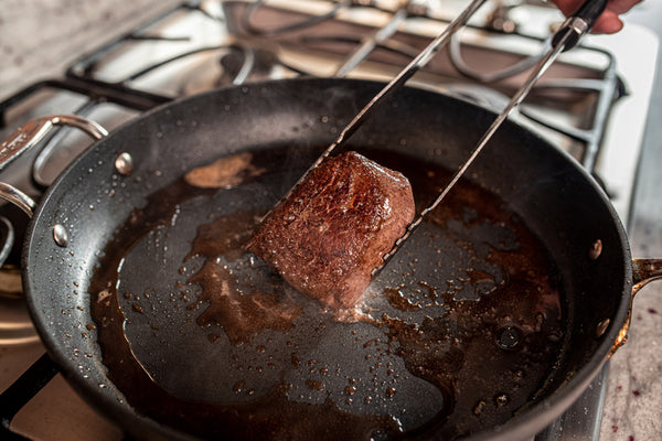 Certified ONYA® filet mignon steak pan seared in a cast iron pan until medium rare. Seasoned with salt and pepper for a beautiful steak crust. Highly tender high-quality beef tenderloin steak