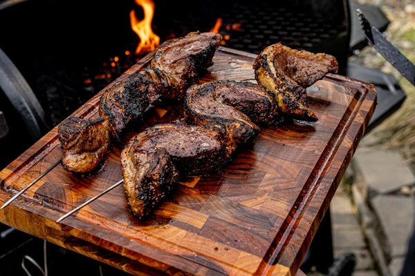 Certified ONYA® beef picanha steaks cooked over an open flame and skewered into the shape of a C half moon for the traditional Brazilian method of cooking this incredible and unique cut of tender beef