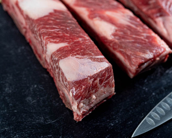 Abundant beef marbling can be seen on these tender beef short ribs with a lot of fatty fat. Certified ONYA® Beef short ribs from BetterFed Beef Company, an online beef company selling premium beef 